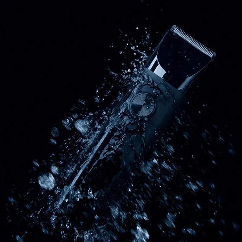 XIAOMI MIJIA Hair Trimmer Machine in a water splash, highlighting its IPX7 waterproof design for wet and dry grooming use.