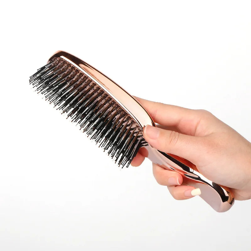 Side view of rose gold hair comb showing flexible bristles – ideal for sensitive scalps