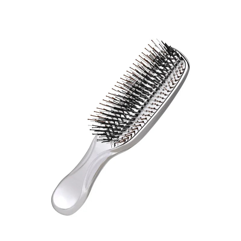 Close-up of silver hair massage comb – high-quality bristles for scalp comfort and hair smoothing