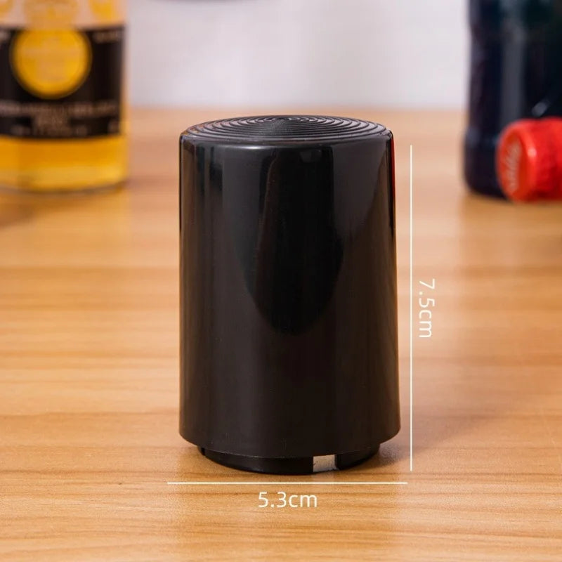 Sleek black bottle opener with measurement labels 7.5cm height and 5.3cm width