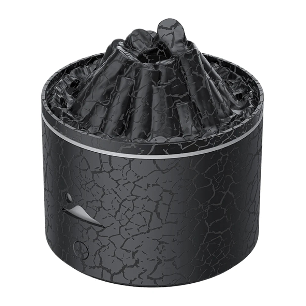 Close-up of the black lava volcano diffuser with cracked texture and realistic crater design