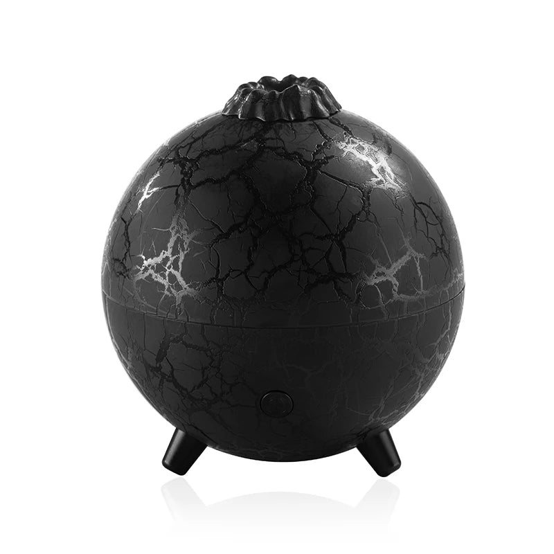 Black spherical humidifier with cracked texture on a white background
