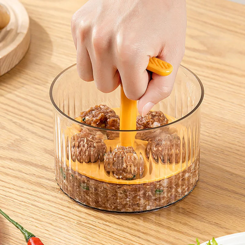 Hand pressing the Meatball Maker to shape five uniform meatballs in a transparent container on a wooden surface.