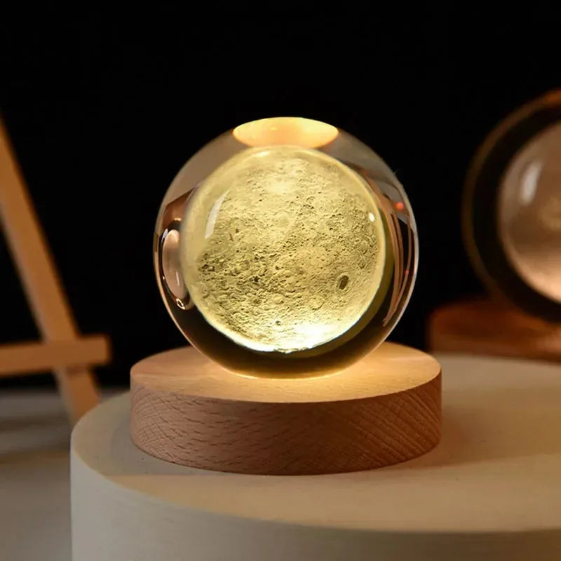 Glass sphere with wooden base on a dark background