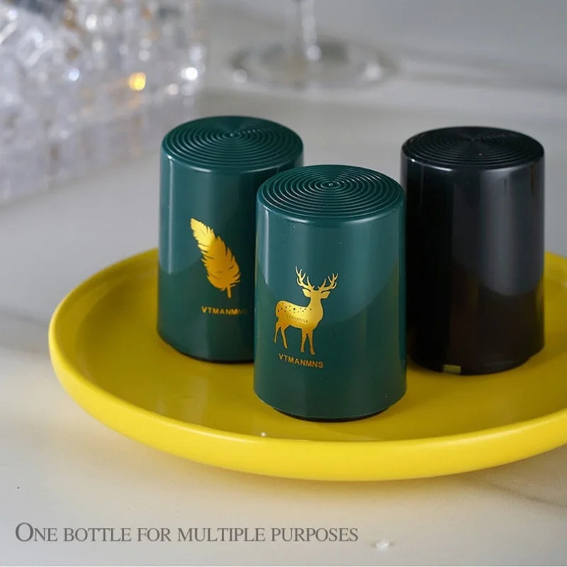 Three stylish bottle openers with feather, deer, and black designs on yellow plate