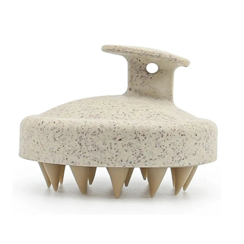 Beige Silicone Shampoo Brush shown from a side angle, featuring its soft bristles and ergonomic handle for scalp massage.