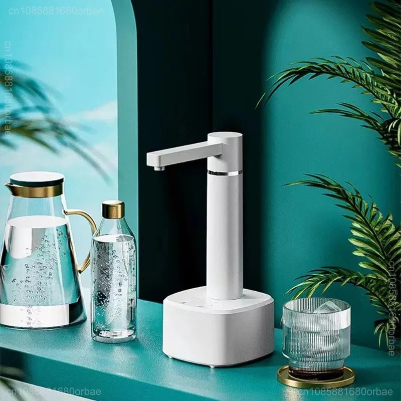 Two white 3-gear Smart Automatic Water Dispensers on large water jugs, placed on a marble table with sunflowers and a teal backdrop.
