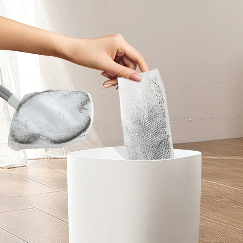 Used disposable mop towel being discarded after cleaning
