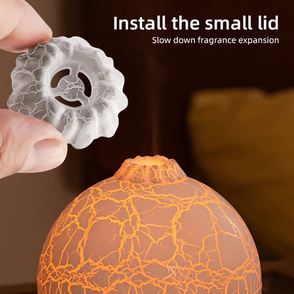 Hand holding a small lid above an orange cracked-patterned container with text on fragrance expansion.