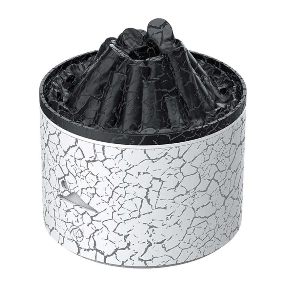 Detailed view of the white lava-style volcano diffuser with dark crater top and textured pattern