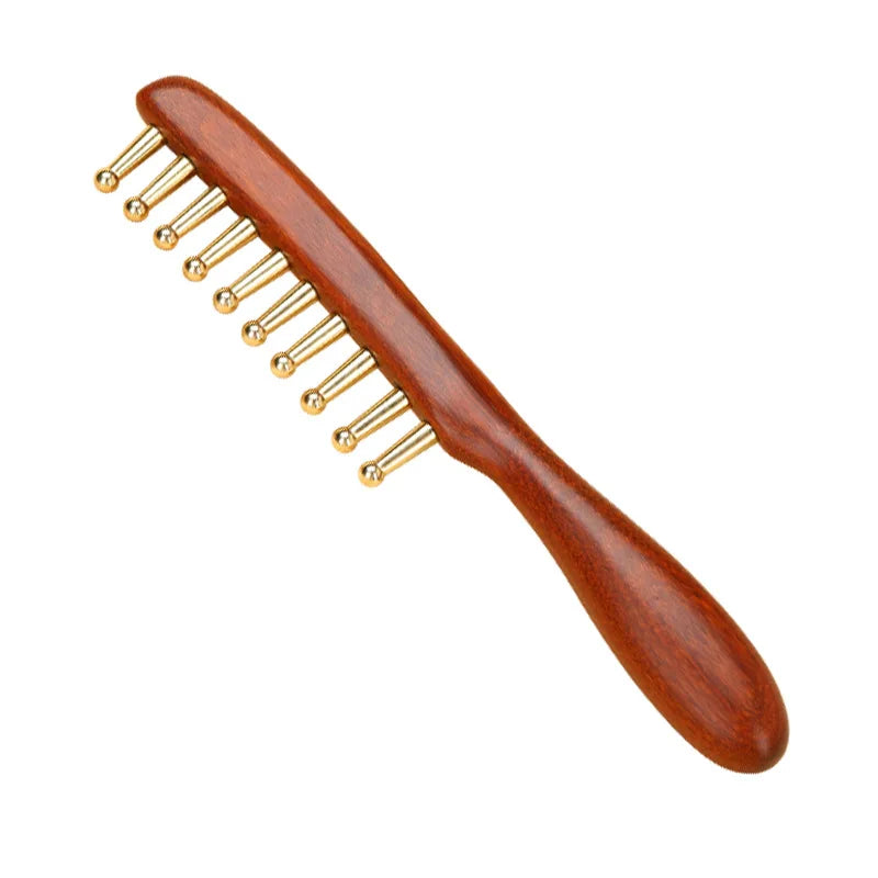 Wooden comb with gold prongs on a white background