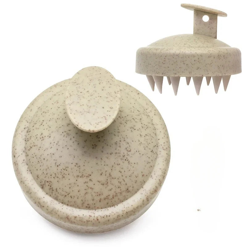 Two beige textured scalp massagers on a white background