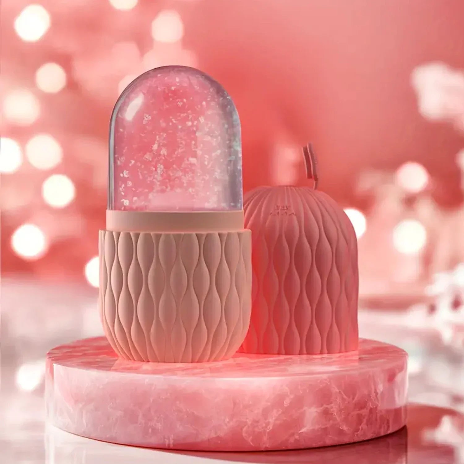 Pink decorative item with a textured base and glass dome against a blurred pink background