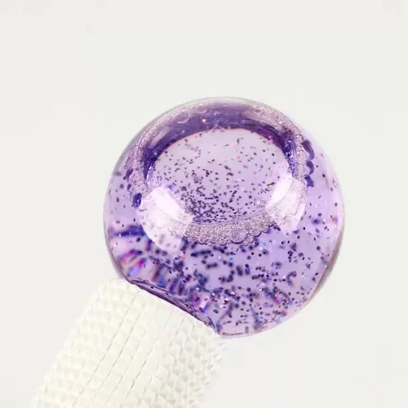 Purple glittery object on a white background