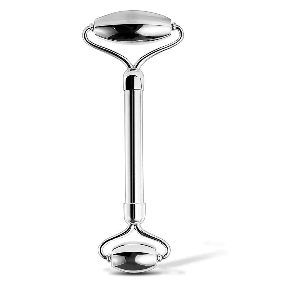 Silver facial roller on a white background