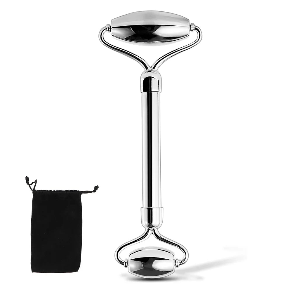 Silver facial roller with black pouch on a white background
