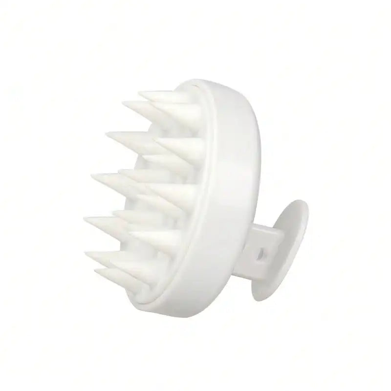 White scalp massager on a white background