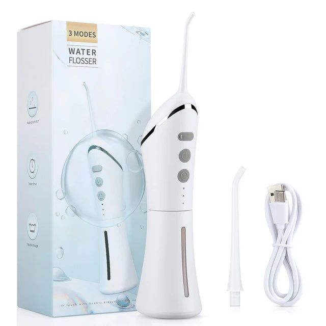 White water flosser with packaging, USB cable, and nozzle on a white background